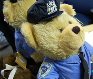 Several teddy bears dressed as public servants, including this police officer, were donated.