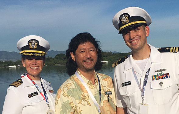 Kaye Sweetser (left) worked alongside former PAO students Jon Yoshishige (center) and Lt. Cmdr. Matt Knight at the Pearl Harbor commemoration in December.