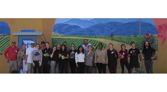 Inmates at the Donovan Correctional Facility joined students from the San Diego State University School of Art and Design to paint a mural in a prison yard.
