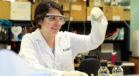 SDSU senior Citlayi Villaseor conducts research in biochemistry professor Tom Huxford's lab. (Photo: Kellie Woodhouse)