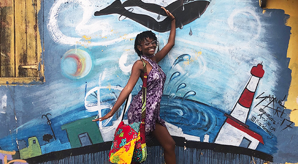 Chasejamison Manar-Spears in Ghana. (Mural by Sage Art)