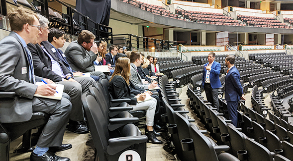 Students in SDSU's Sports MBA program listen to Anaheim Ducks executives at the Honda Center in February