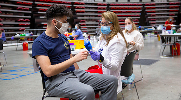 Through a partnership with the county, SDSU has been hosting one of the largest county-led vaccine sites at Viejas Arena since March.