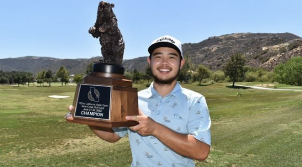 Ex-SDSU golfer Zihao Jin holds up the California State Open winner's trophy, his first professional title of his career.