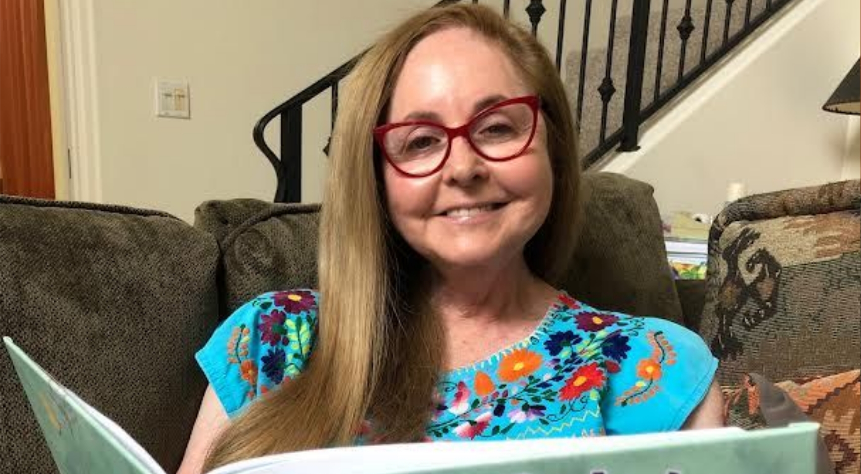 SDSU alumna Phyllis Schwartz sits in her home and reads a passage in her upcoming book, When Mom Feels Great, Then We Do Too, to be released Sept. 23, 2022.