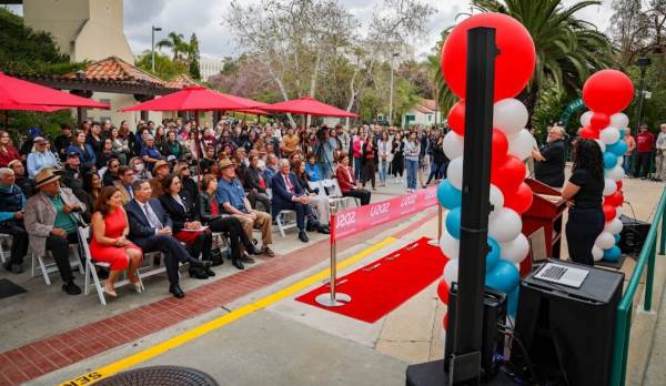 Ellen Ochoa and her husband Coe Miles (front row in blue shirt) are joined by SDSU president Adela de la Torre. 300 people attended Friday's dedication ceremony of the Ellen Ochoa Pavilion at SDSU, May 5, 2023. (Rachel Crawford / SDSU)