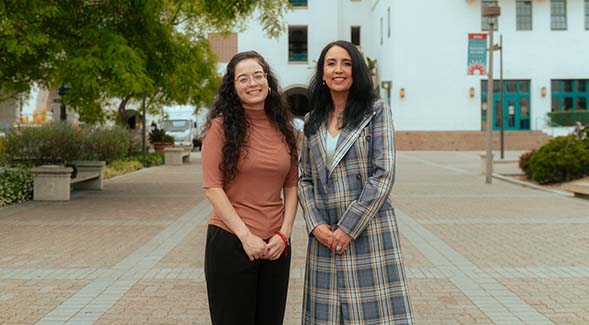 Assistant professor Wendy Ochoa (left) and Rosie Villafana-Hatcher, director of the Early Assessment Program, posed on Centennial Walkway. (Photo: Arturo Rivas Ojeda)
