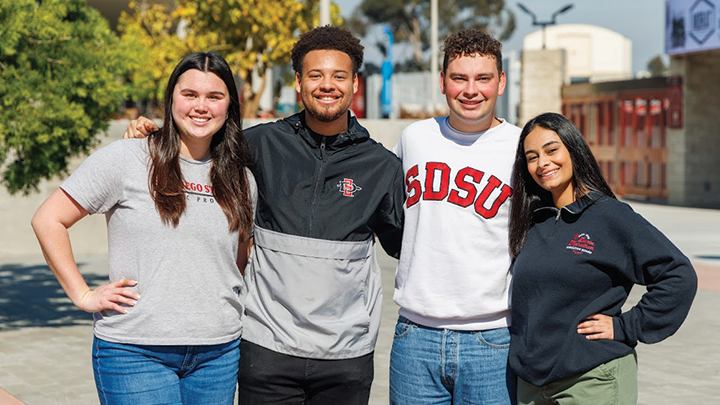 Students pose for photographs on the campus of San Diego State University.
