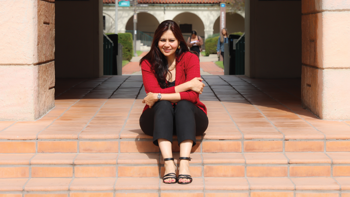 Professor of Electrical and Computer Engineering Mahasweta Sarkar sitting on the steps of Hepner Hall at San Diego State University.