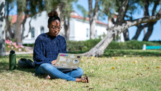 Student looking at their laptop