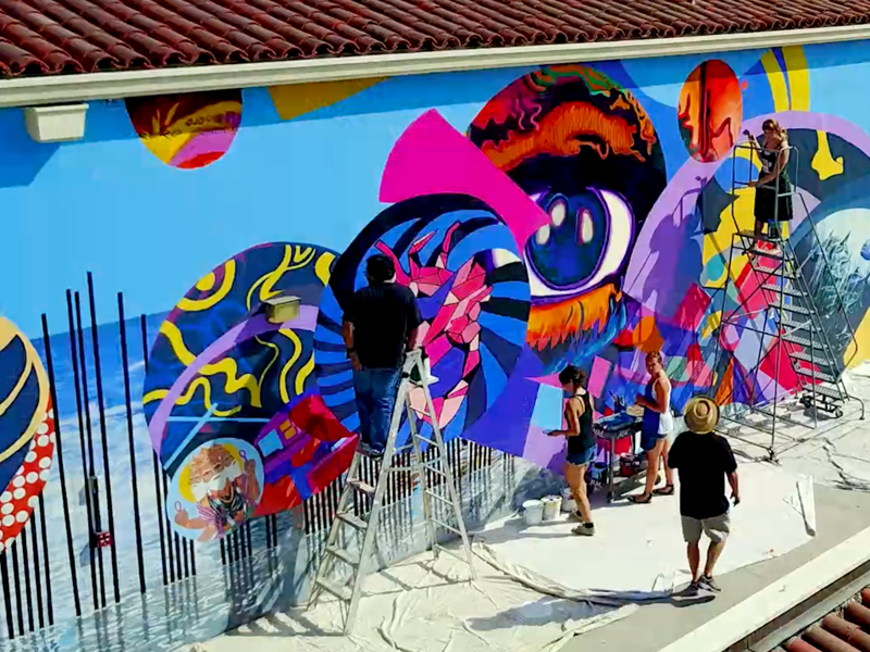 Students painting a mural