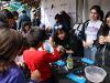 SDSU’s Society of Women Engineers facilitated a DIY mini lava lamp necklace activity to teach about liquid density.