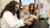 Assistant Biology Professor Cristal Zuniga works with three of Beach’s students to measure the pH of their algae samples (Bryana Quintana / SDSU)
