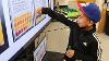 Another student from Beach’s class matches his test strip to the screen to measure its pH (Bryana Quintana / SDSU)