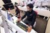 Tools within the Financial Markets Laboratory have helped to train Sasan Ahadian (left) and Patsi Velez Llanes to trade and analyze stocks, bonds, commodities and other investment assets. (Andre Young/SDSU)