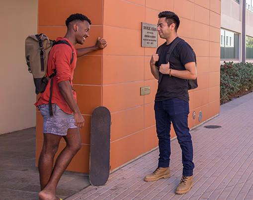 Veteran students talking outside Storm Hall.