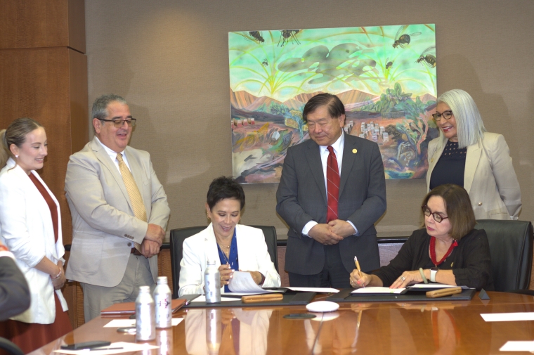 Mexico Consul General in San Diego Alicia Kerber Palma, left, signs a partnership agreement with SDSU President Adela de la Torre to create a binational guest lecturer exchange
