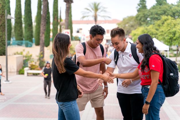 Group of students interacting with each other. 