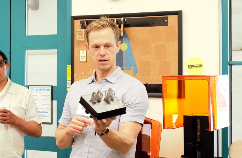 Cameron Brock, manager of Idea Lab, shows Tijuana students product prototyping work from the lab’s 3D printers