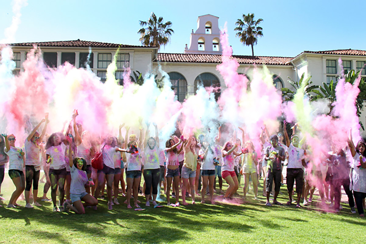 Students throwing colored chalk