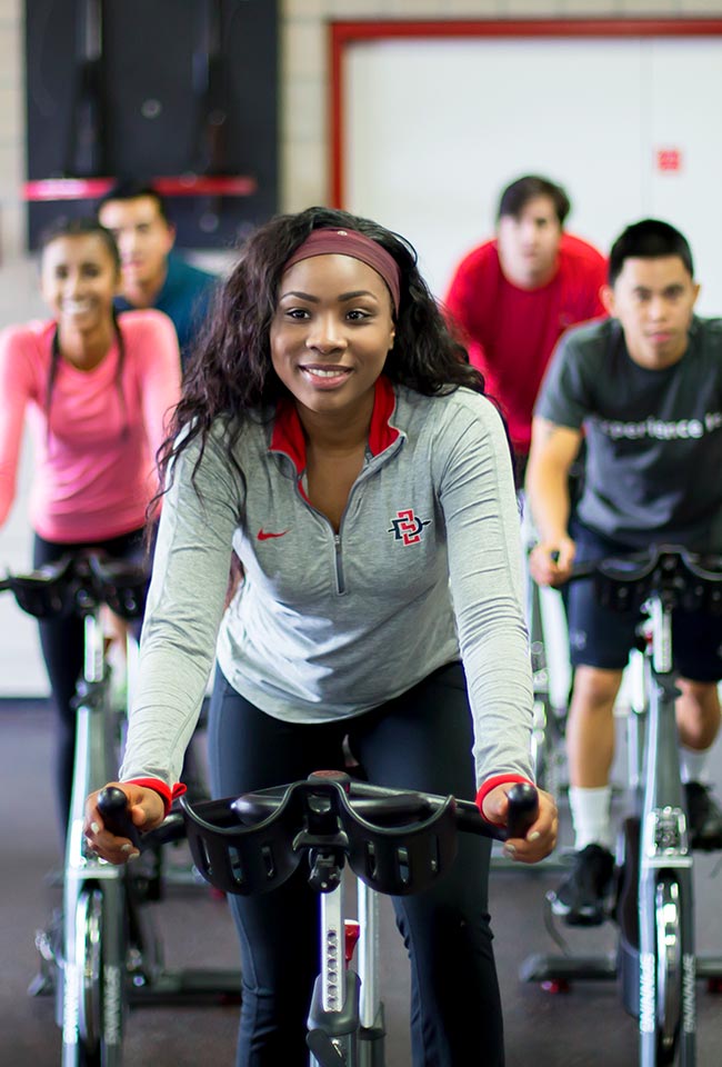 Students ride exercise bikes at the ARC