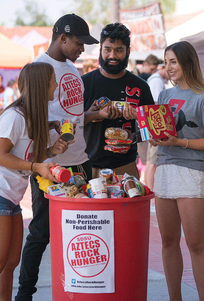 Students donate food for the Aztecs Rock Hunger food drive