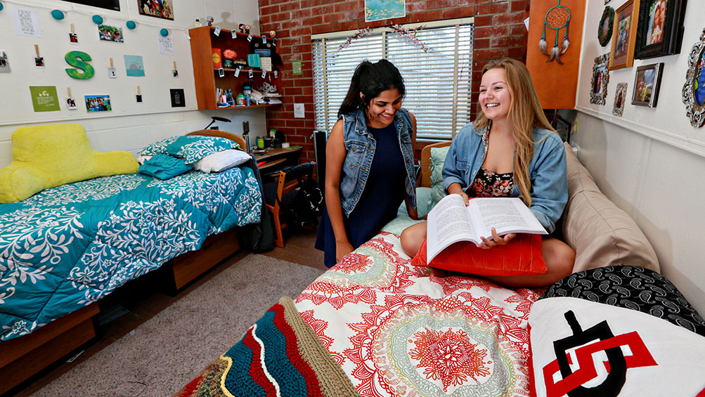 Two students in a dorm room