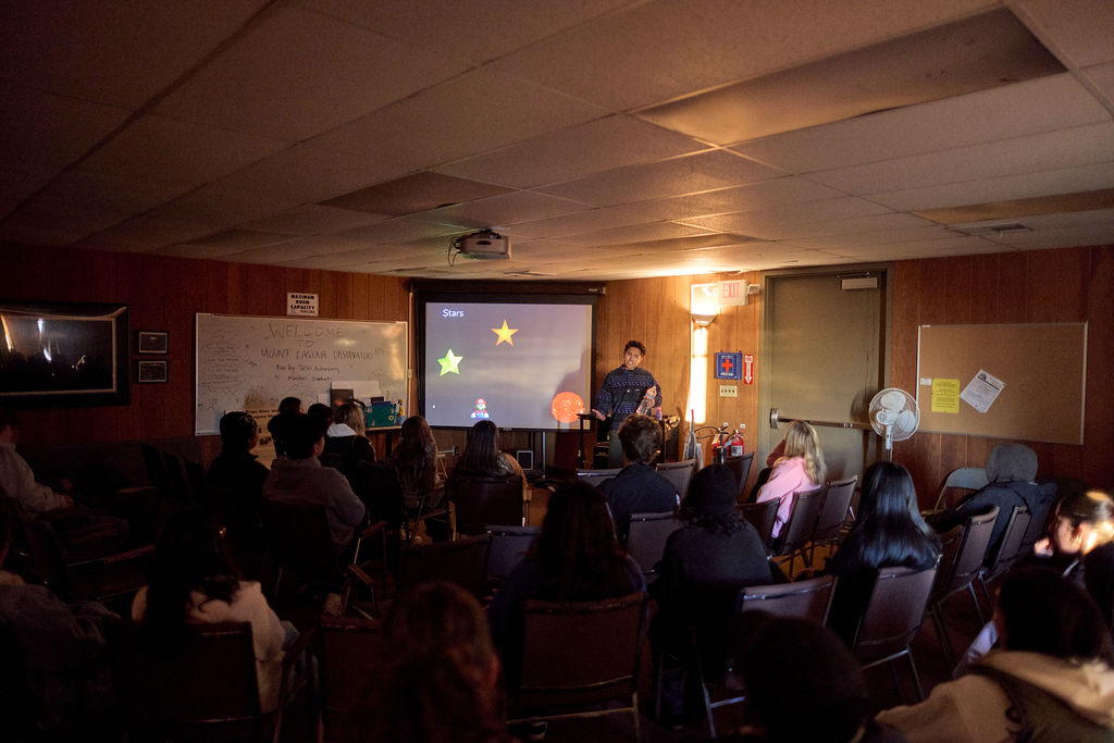 A person standing in front of a classroom.