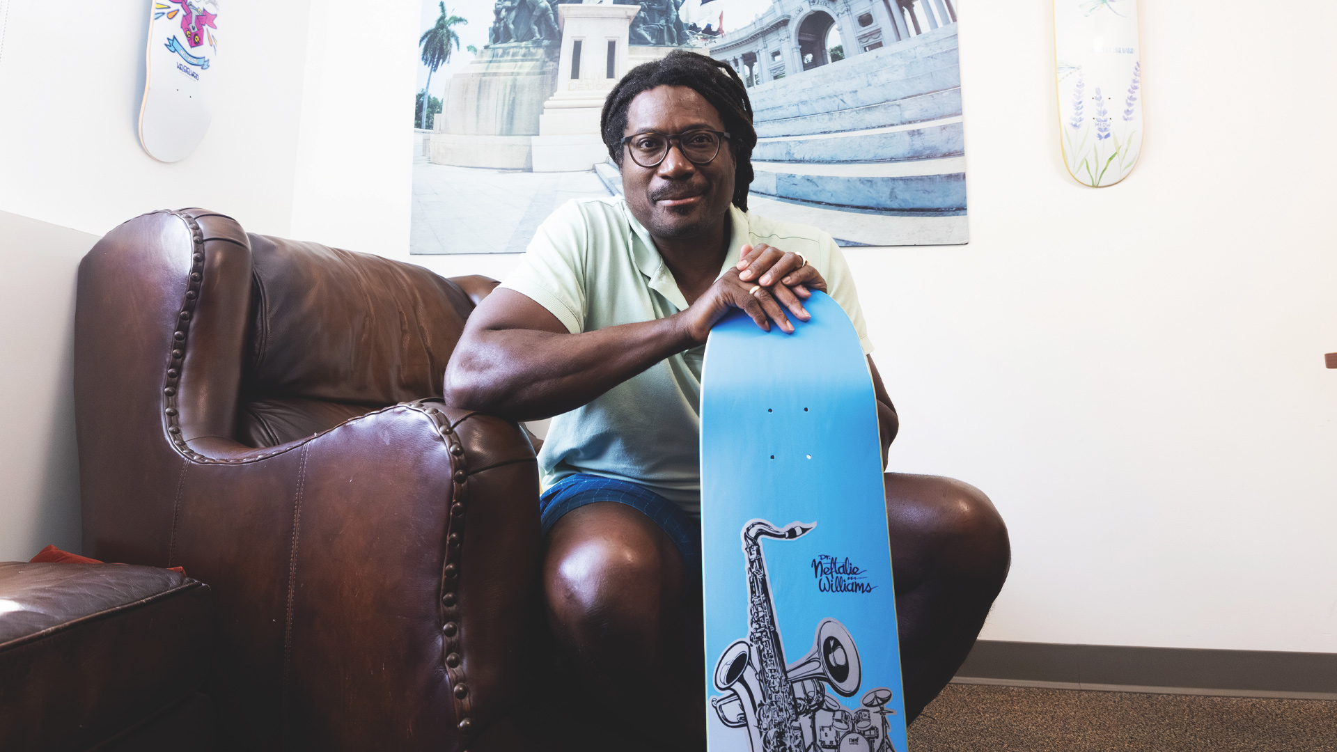 Neftalie Williams with skateboard deck