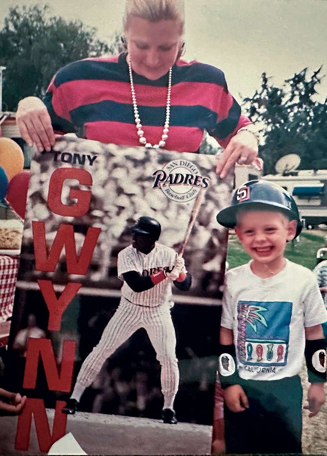 Young Stephen Strasburg, standing next to a Tony Gwynn poster
