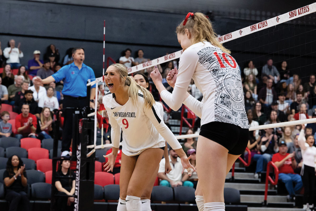 Shea Rubright (’24) and Taylor Underwood celebrating on the volleyball court