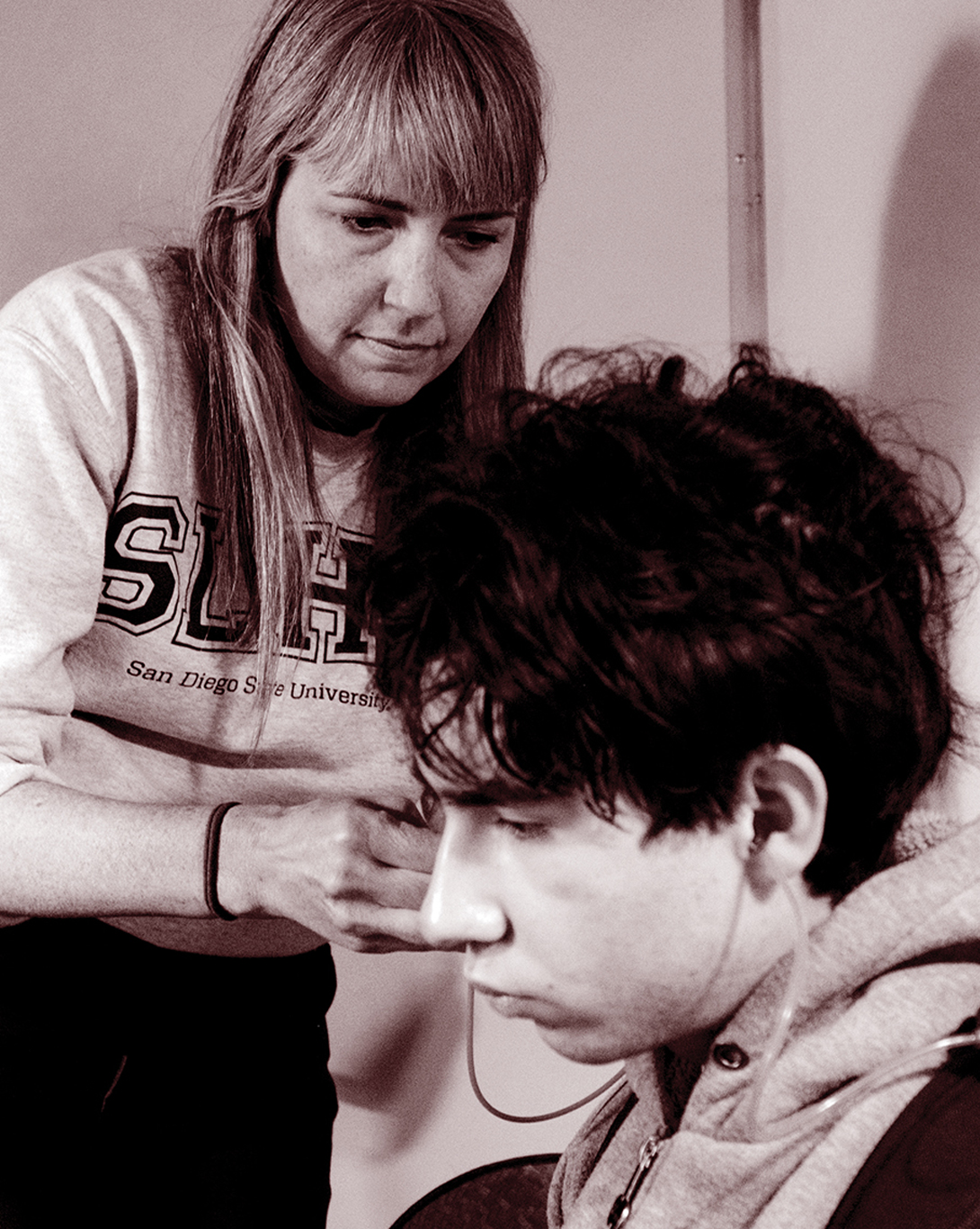 Laura Coco conducting an ear exam