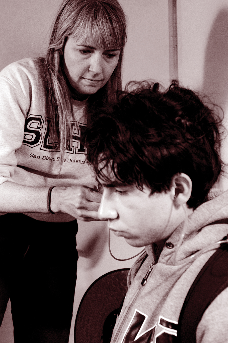 Laura Coco conducting an ear exam
