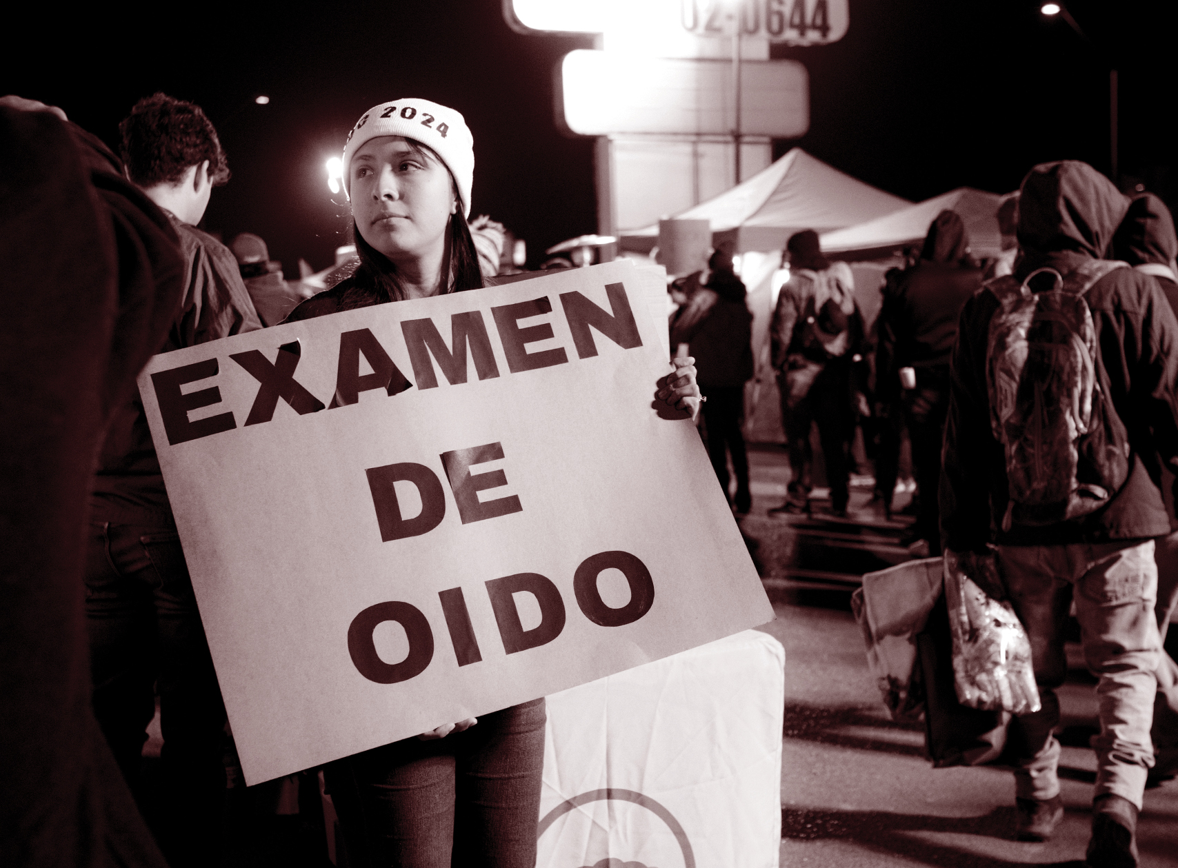 A volunteer with the event organizer, Campesinos Sin Fronteras, advertises “Examen de Oido,” which translates to ear exams.