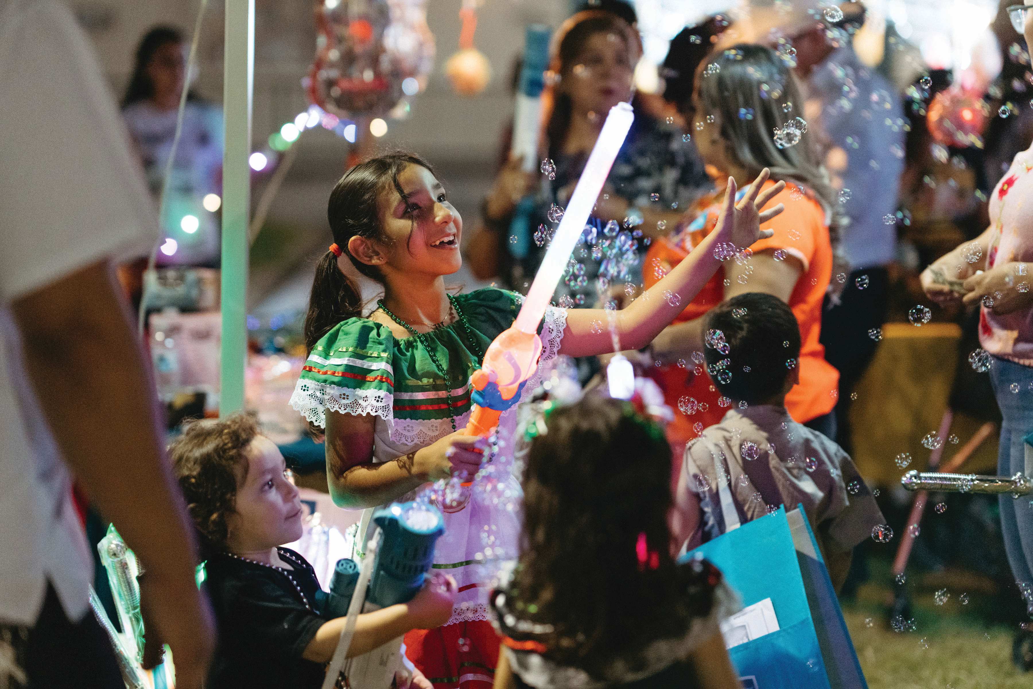 A child playing with bubbles