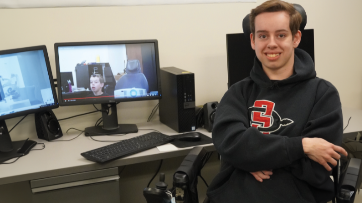 Cody Harris in front of a computer screen