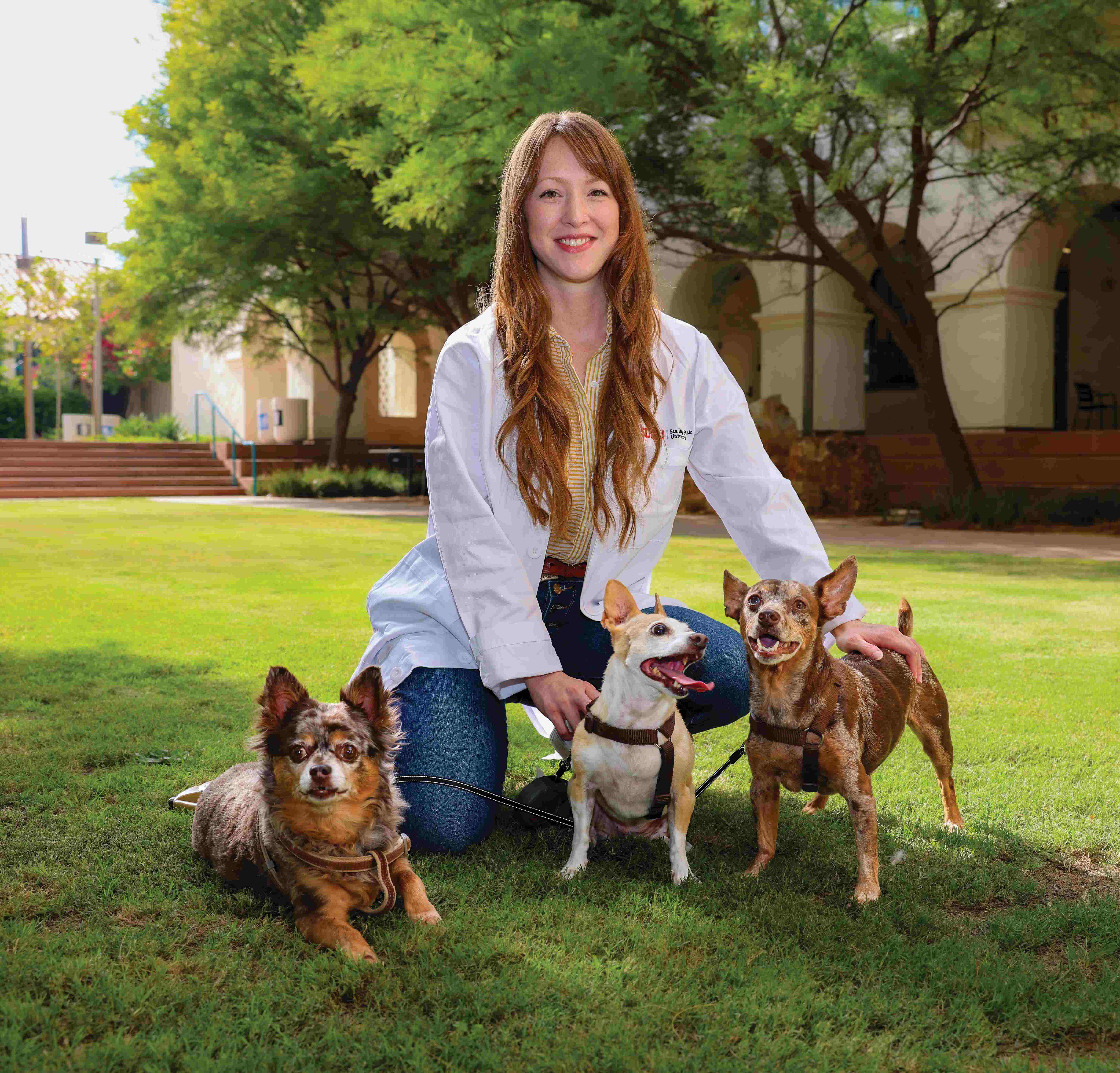 A photo of Lilith with 3 dogs