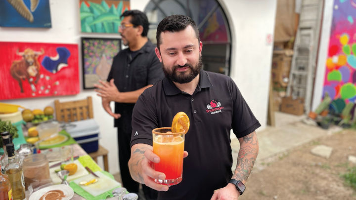 Enrique Hernandez presenting a cocktail