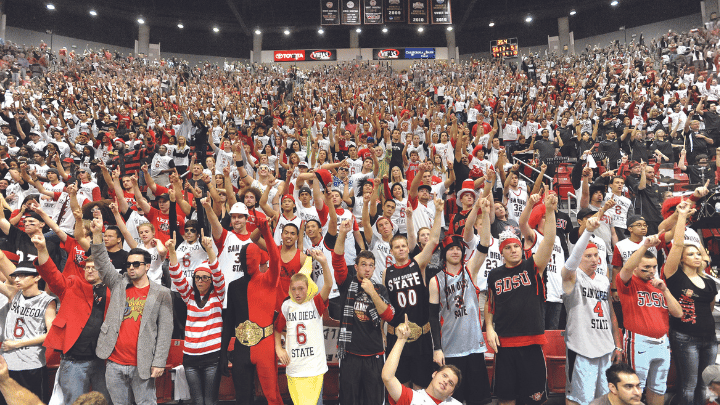 A crowd of people cheering for SDSU Aztecs at Viejas Arena