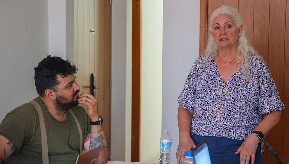 Cristina Rios working with Mesoamerican cooking equipment