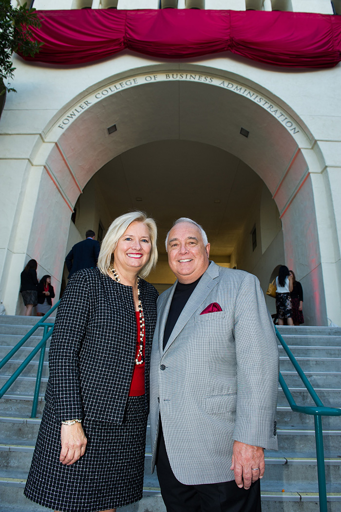 A man and women behind the Fowler School of Business