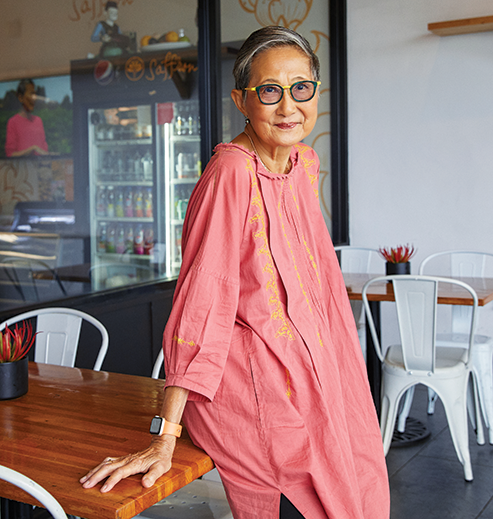 Su-Mei Yu posing in her restaurant