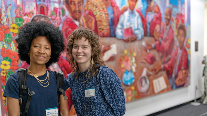 SDSU alumni Sabrina Davidson (left) and Avia Ramm collaborated on “The Black in Crimson and Black” mural in the University Library. Photograph by Leobardo Ramirez.