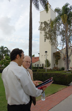 Seth Mallios, left, shares an old photograph of Hardy Tower with Gray Brechin.