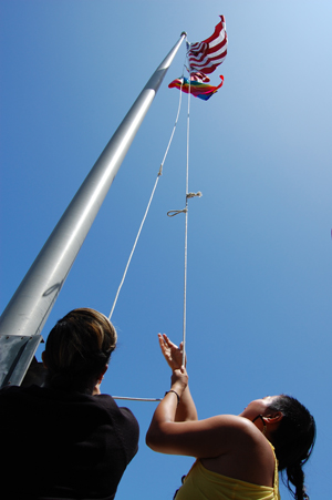 Pride flag being raised