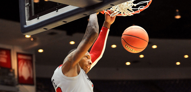 Billy White dunks with authority in the Aztecs' 68-50 win vs. Northern Colorado.  Photo by Ernie Anderson.