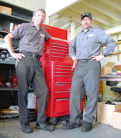 Vistercil (left) and Shaw service the university's fleet of vehicles and grounds maintenance equipment.