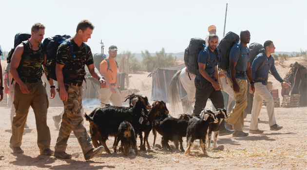 The Football Players (right) are one of 13 three-person teams on the show. (ABC/GILLES MINGASSON)