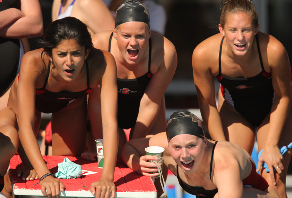 SDSU swimmers cheer on a teammate
