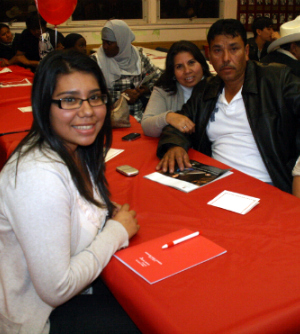 A young student celebrates during the College Avenue Compact banquet.